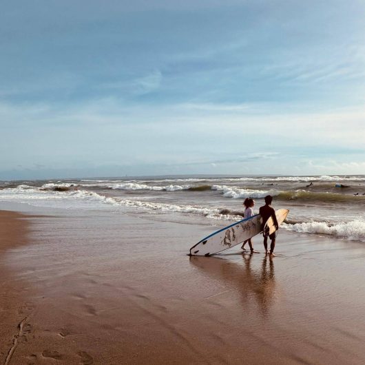 Is Canggu Worth Visiting. 2 surfers in Echo Beach, Canggu.